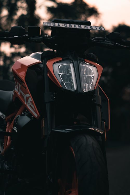 Free Detailed close-up of a motorcycle's headlight and front wheel, showcasing modern design. Stock Photo