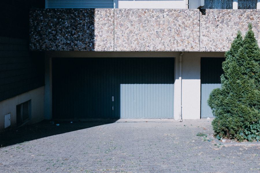 Contemporary home exterior featuring dual garage doors
