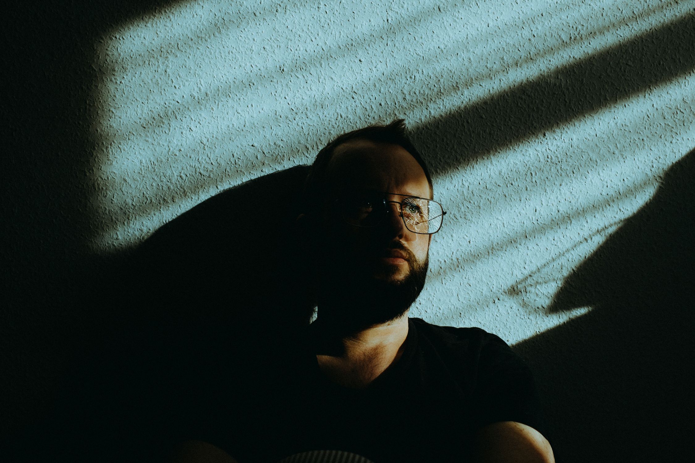 Man Wearing Sunglasses on White Wall · Free Stock Photo