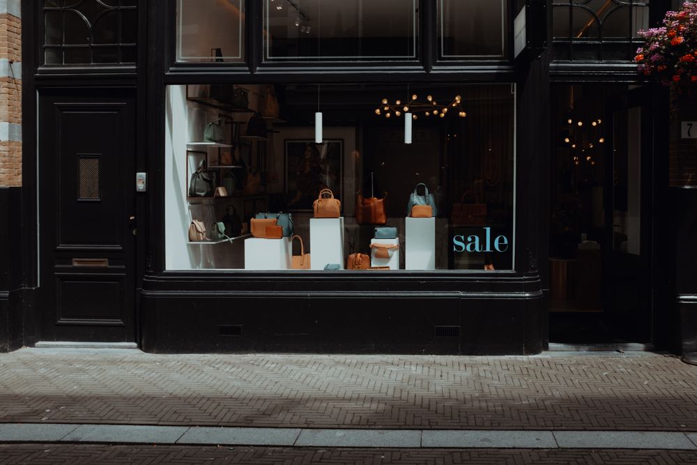 Dark boutique storefront with display window
