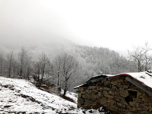 Stone Shack in Winter Mountain Landscape