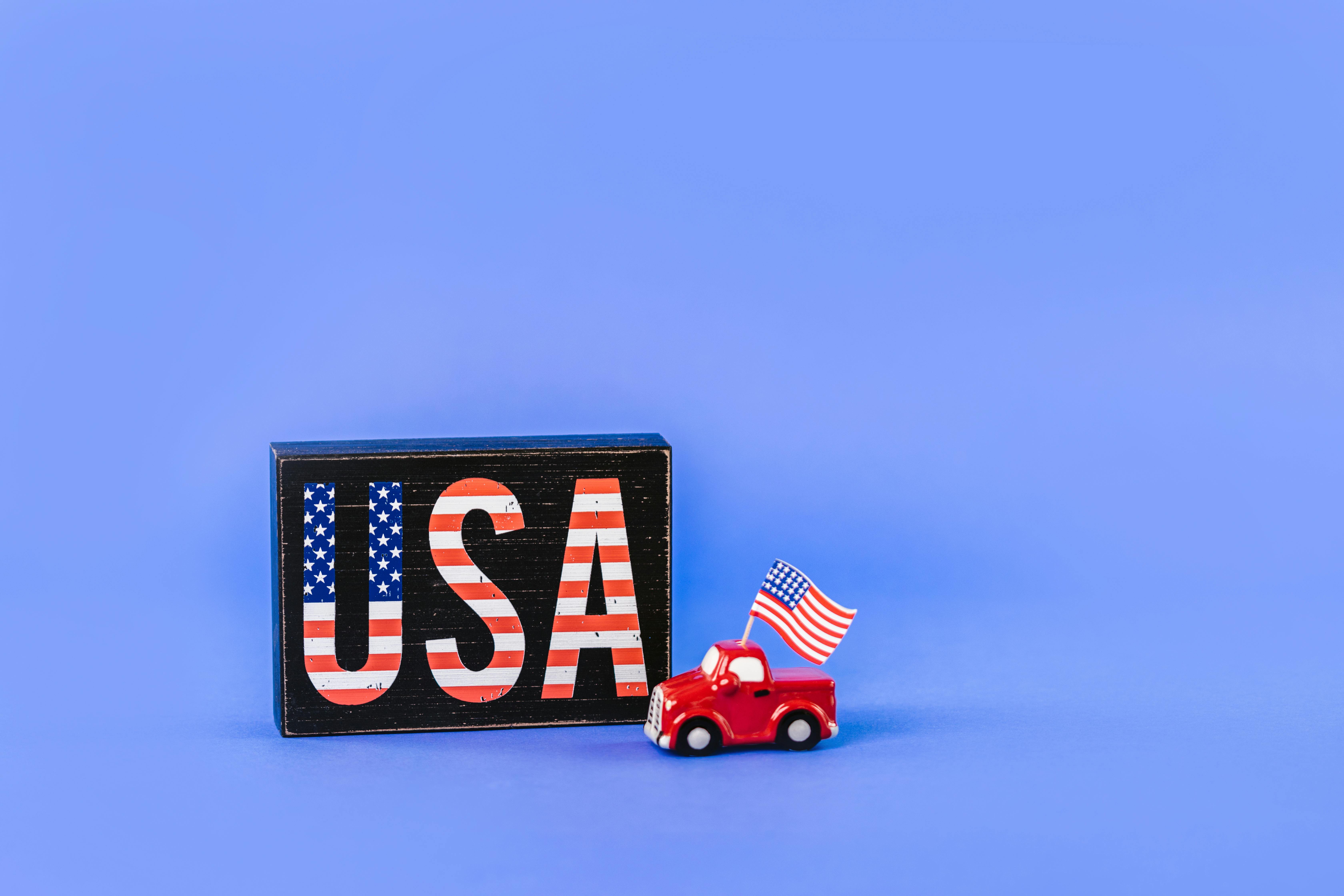 a car figurine with american flag