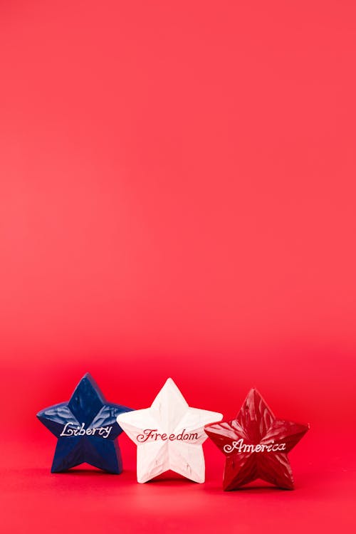 Star Shape Decorations on Red Background