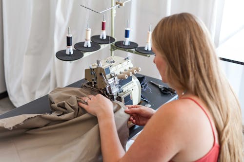 A Woman Using a Sewing Machine