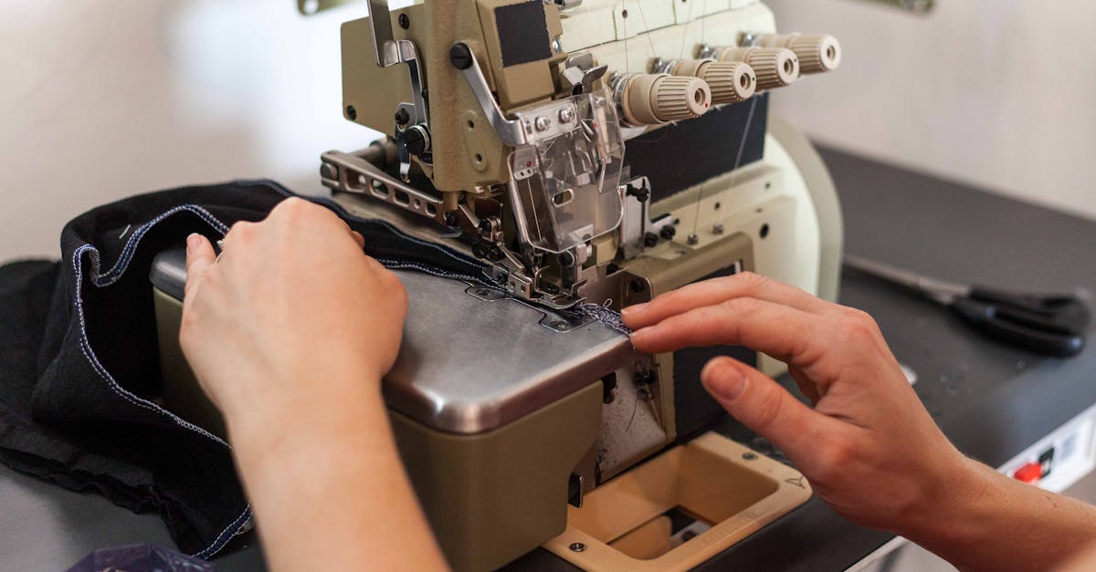 A Person Using a Sewing Machine · Free Stock Photo