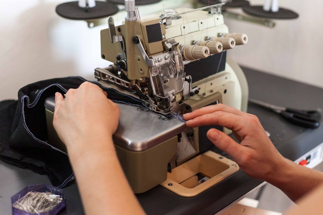 Person Using Stitching Machine A Person Using a Sewing Machine · Free Stock Photo