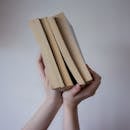 A Person Holding Books