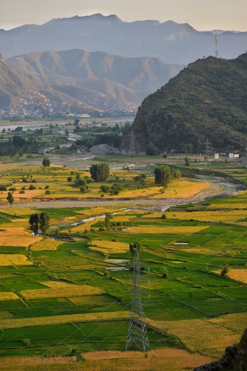 Aerial View of an Agricultural Land Near Mountain