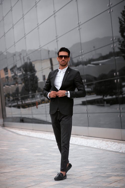 Stylish Man in a Suit Standing outside a Building