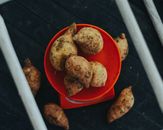 Brown and White Food on Red Round Plate