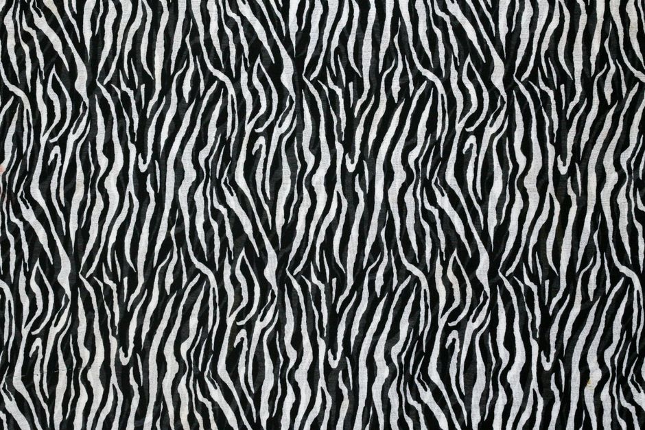 Seamless zebra pattern in black and white, ideal for backgrounds and design projects.
