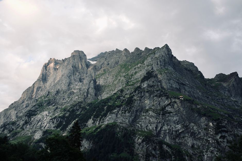 Stunning view of a rugged mountain under an overcast sky, showcasing natural beauty and dramatic terrain.