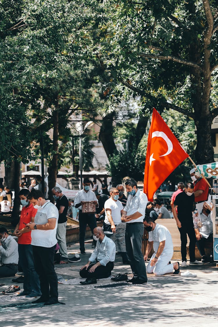 Crowd Of People Praying Outside