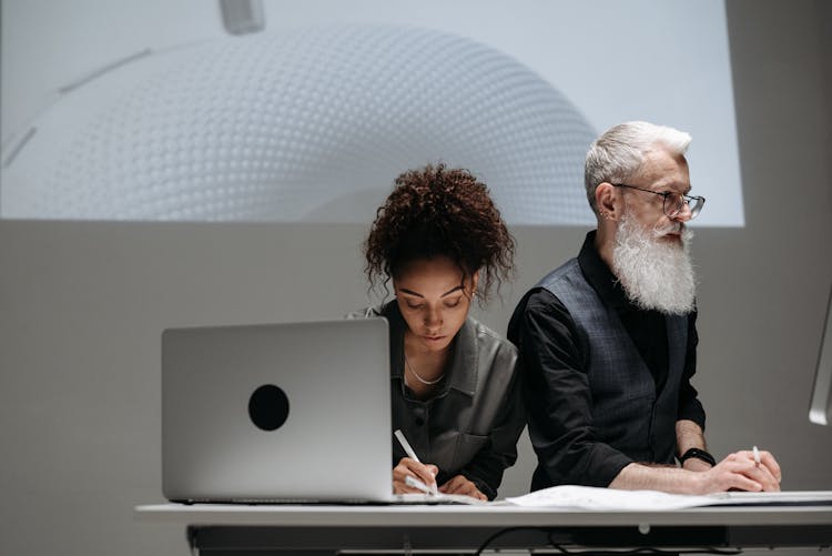 A Man And A Woman Working Together