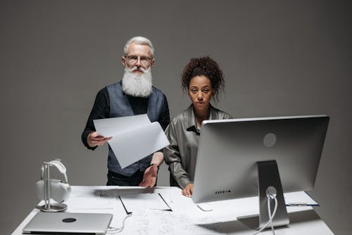 A Bearded Man Holding a Document