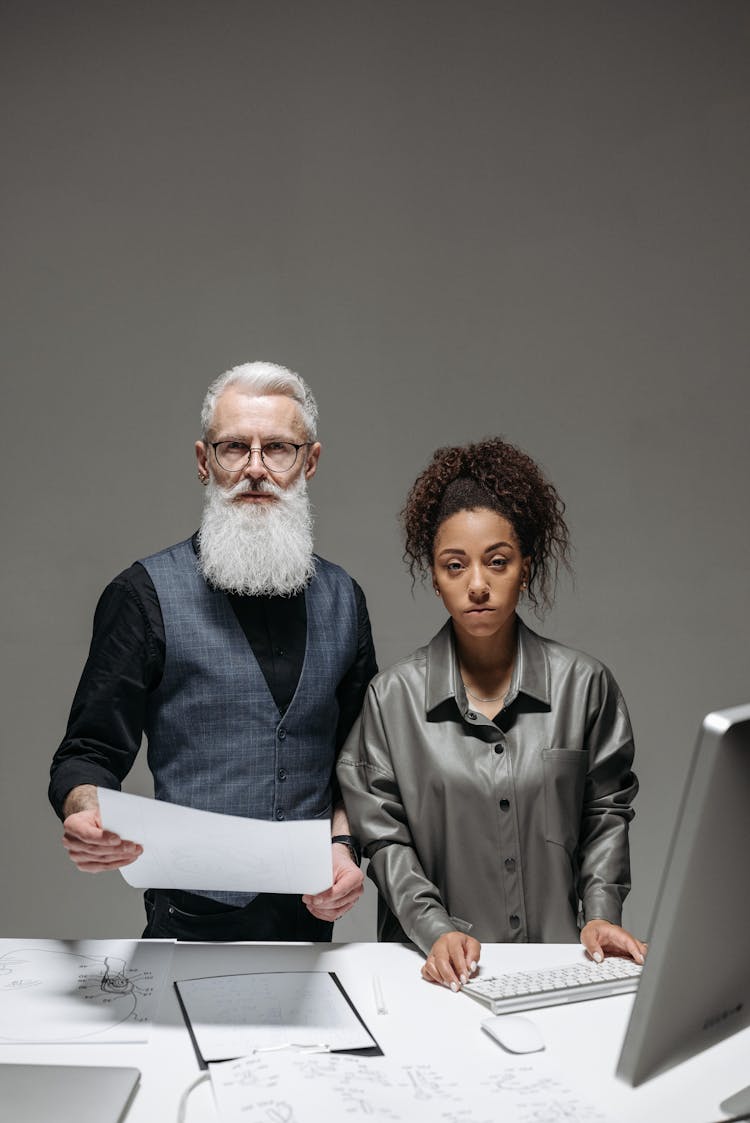 A Man Holding A Document