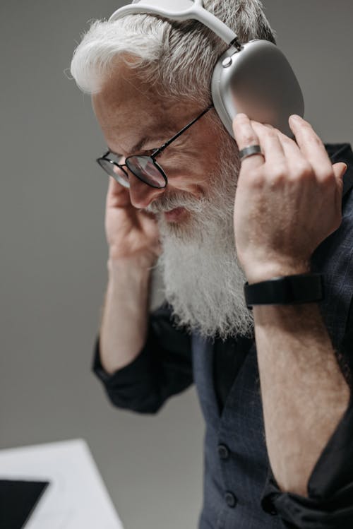 A Businessman Using Wireless Headphones