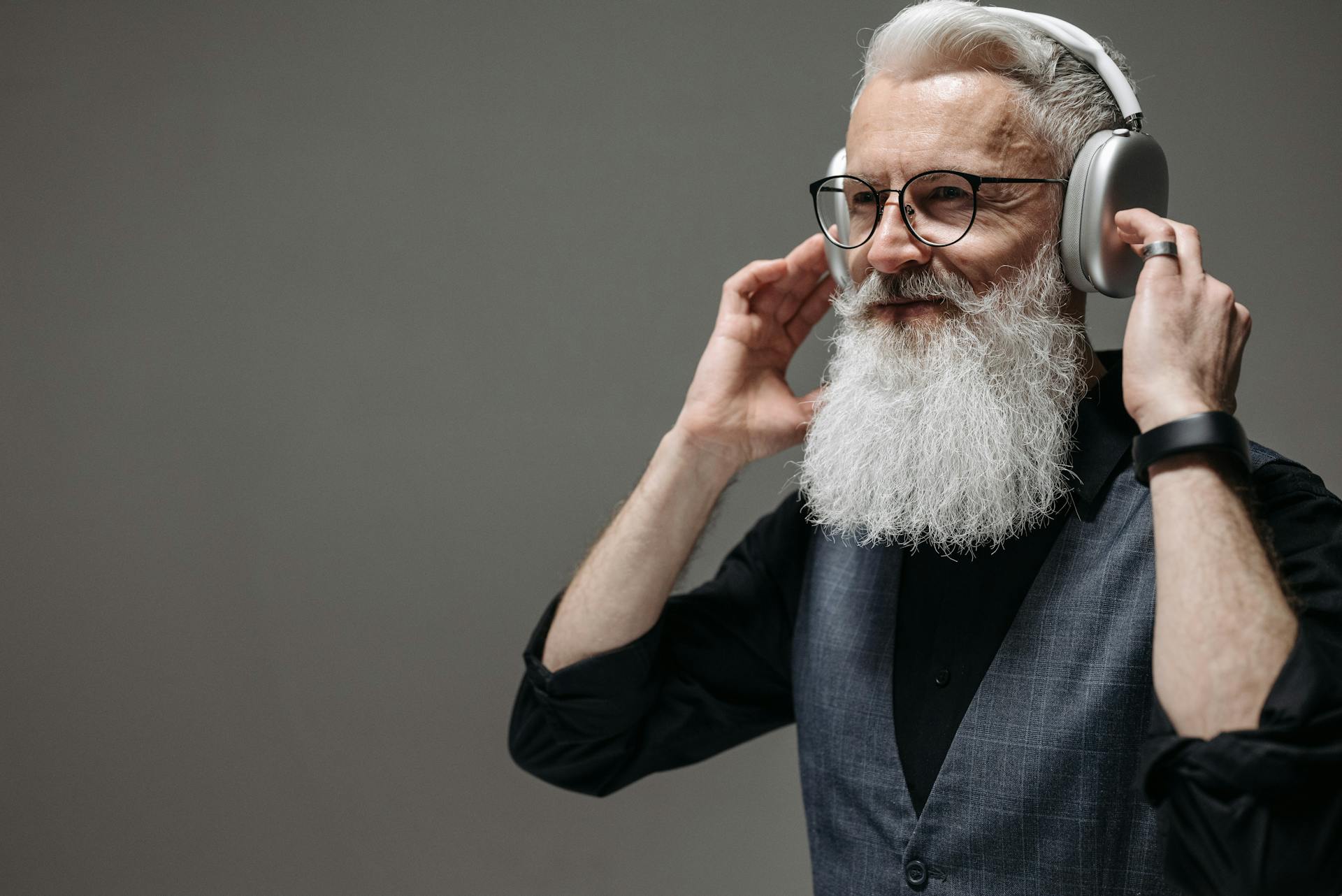 A Bearded Businessman Wearing Wireless Headphones