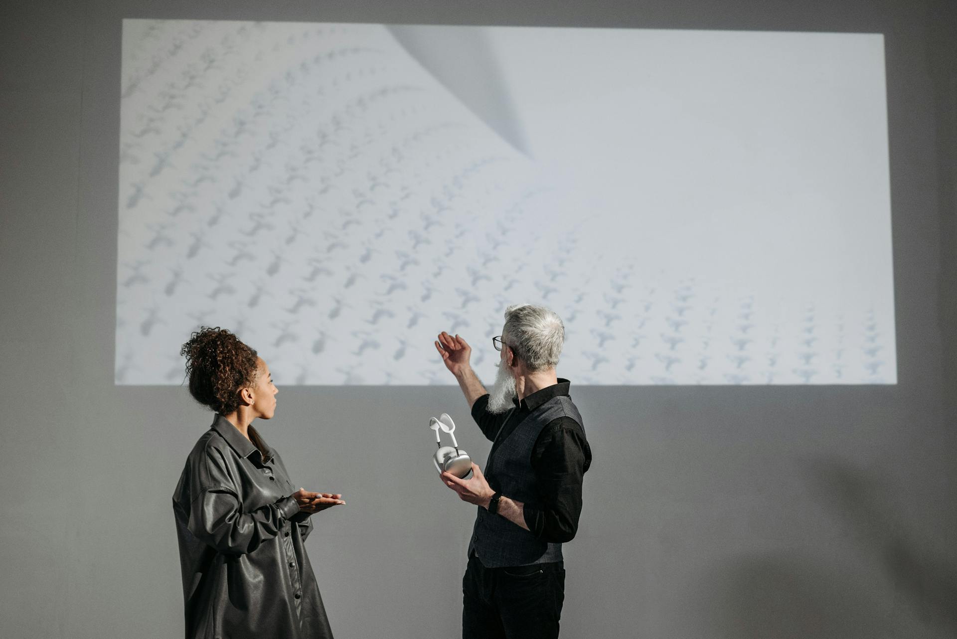 A Man Pointing at a Projection