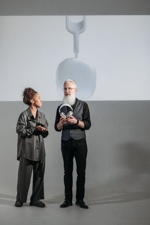 A Man Discussing a Wireless Headphones on a Presentation