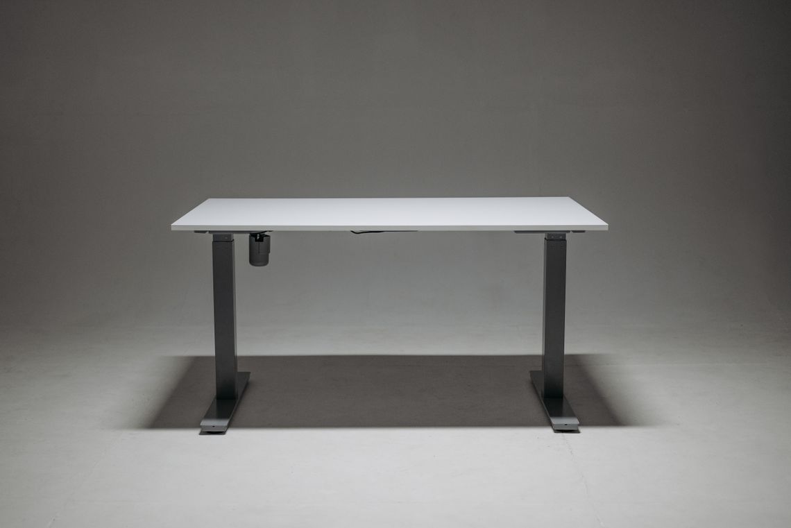 White height adjustable desk designed for an ergonomic workspace