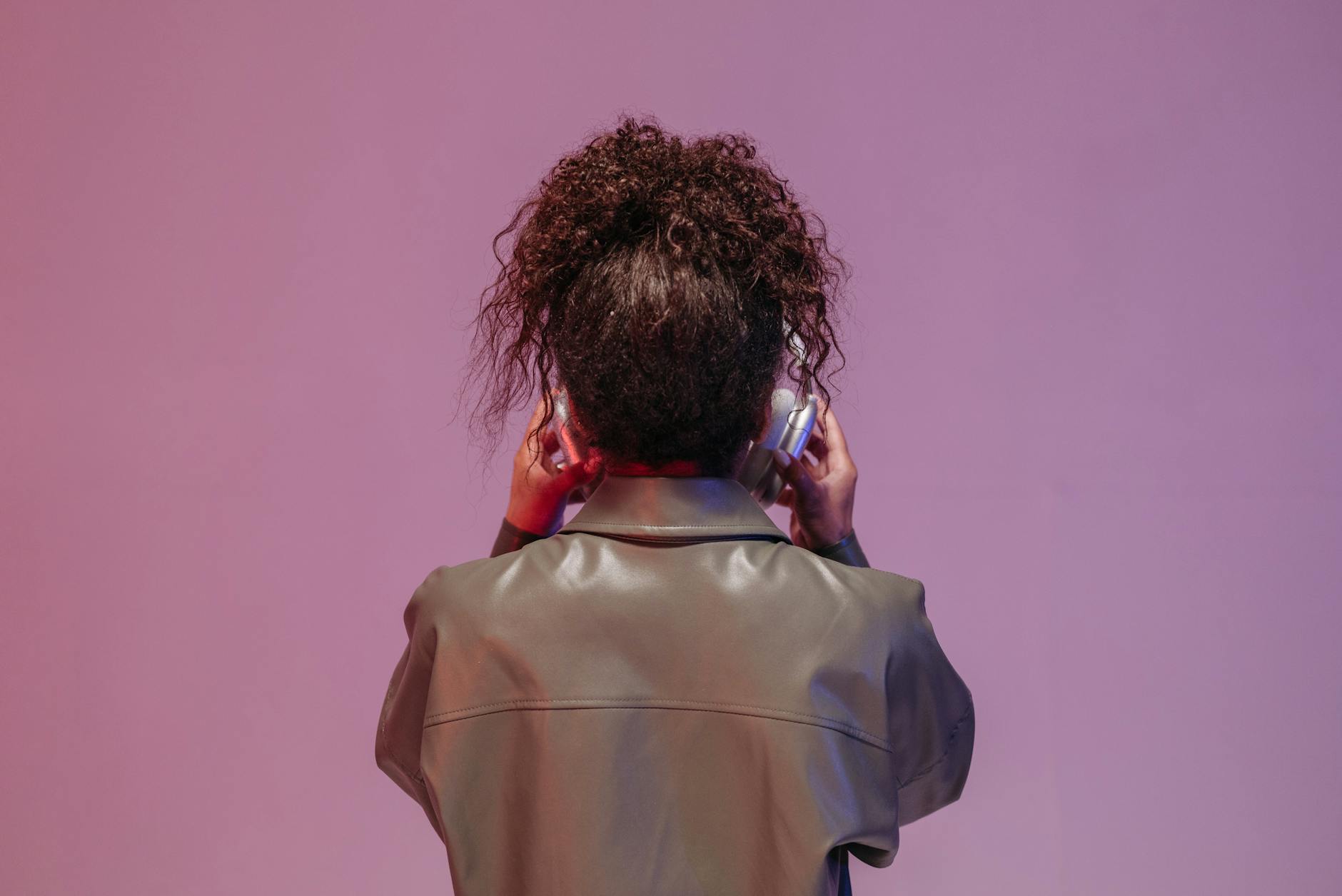Back View of a Woman Wearing a Headphone