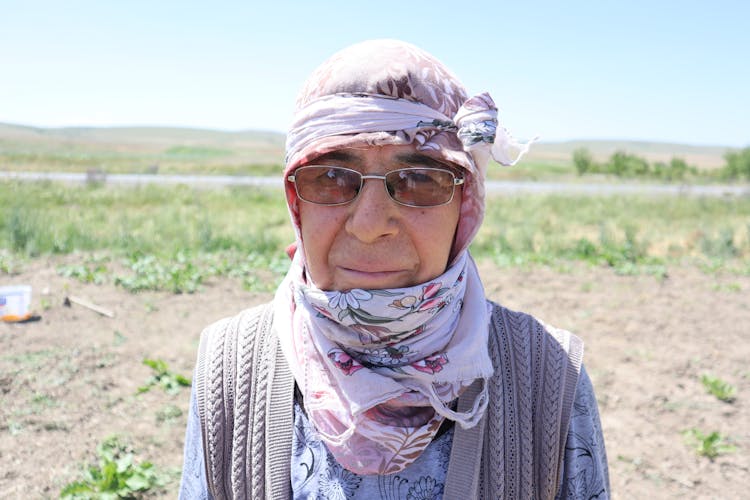 A Person Wearing A Headscarf And Sunglasses