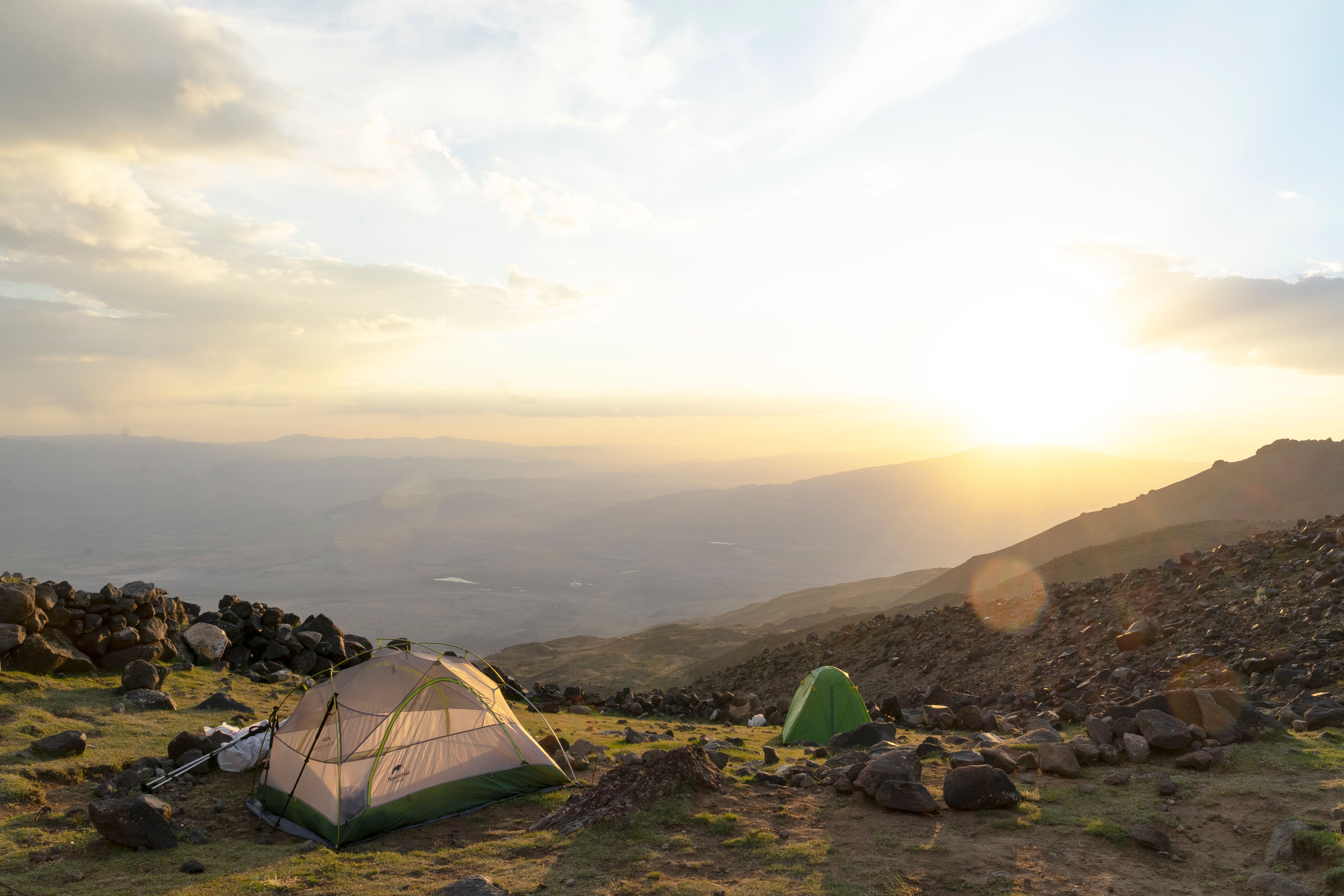 Outstanding 9 Day Northern Circuit Route Kilimanjaro Private Expedition Review 2026 - Serene sunrise over tents in rocky mountains of Karagüney, Iğdır, Turkey.