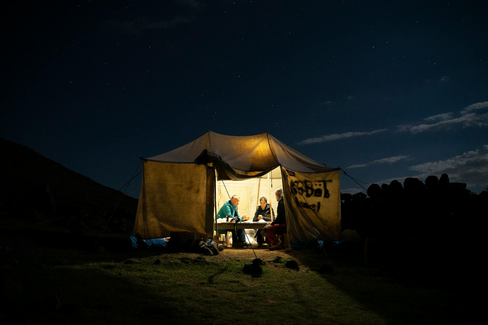 Cozy camping scene under a starry night sky in Karagüney, Iğdır, Turkey.