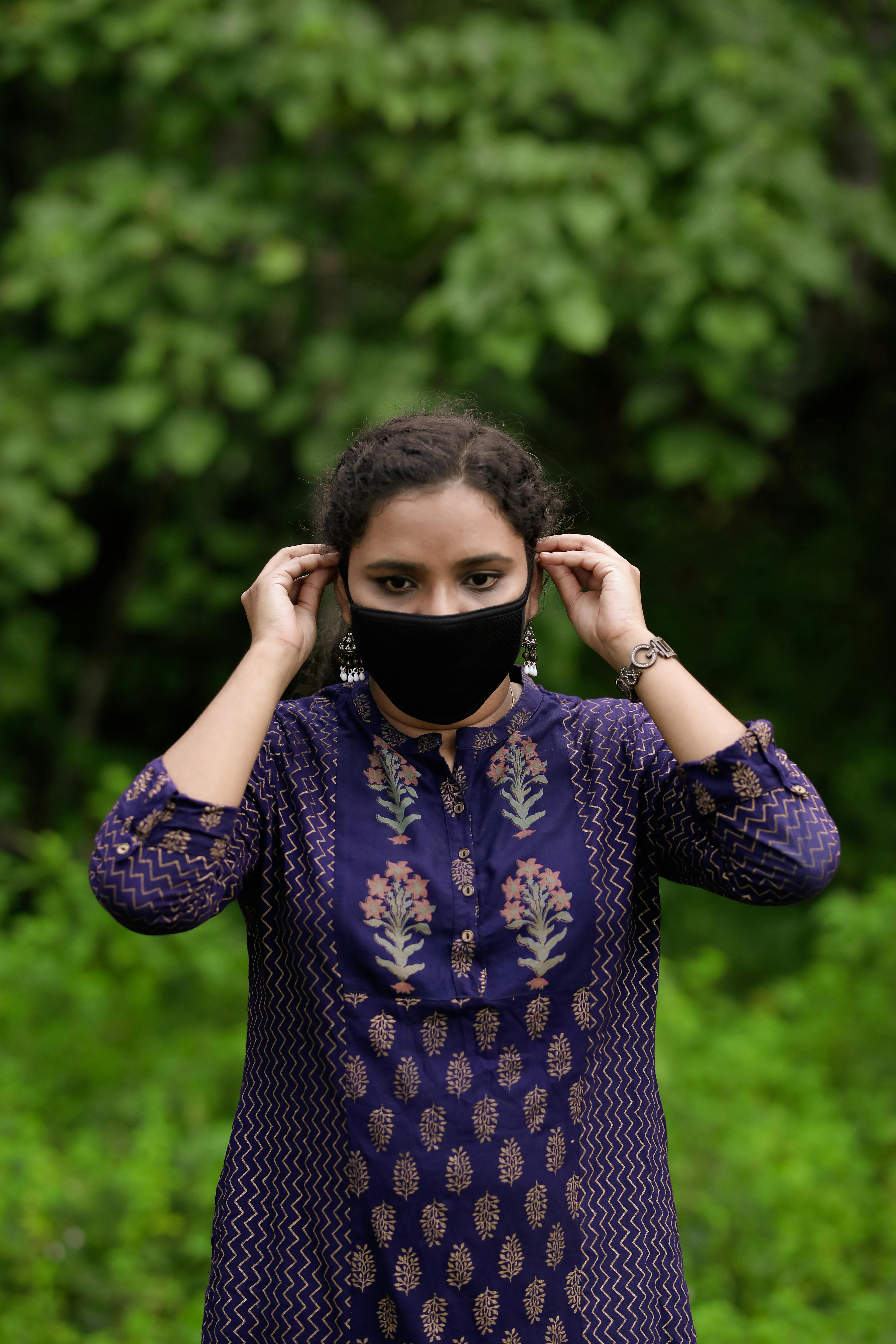 a woman wearing a face mask