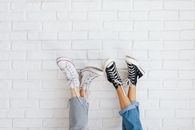 Two People Wearing Converse Shoes