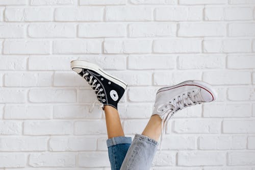 Free Women Wearing Converse All Stars in Contrast Color Stock Photo