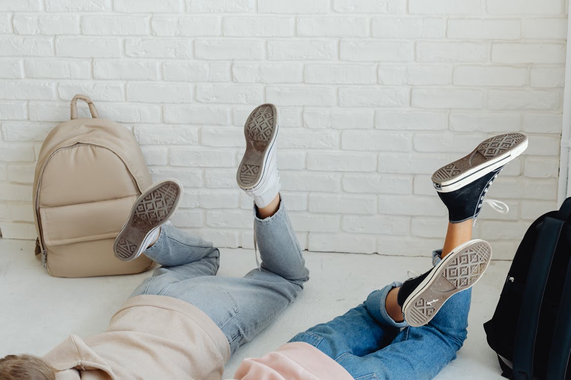 Free A Close-Up Shot of People Lying Down on the Floor Stock Photo