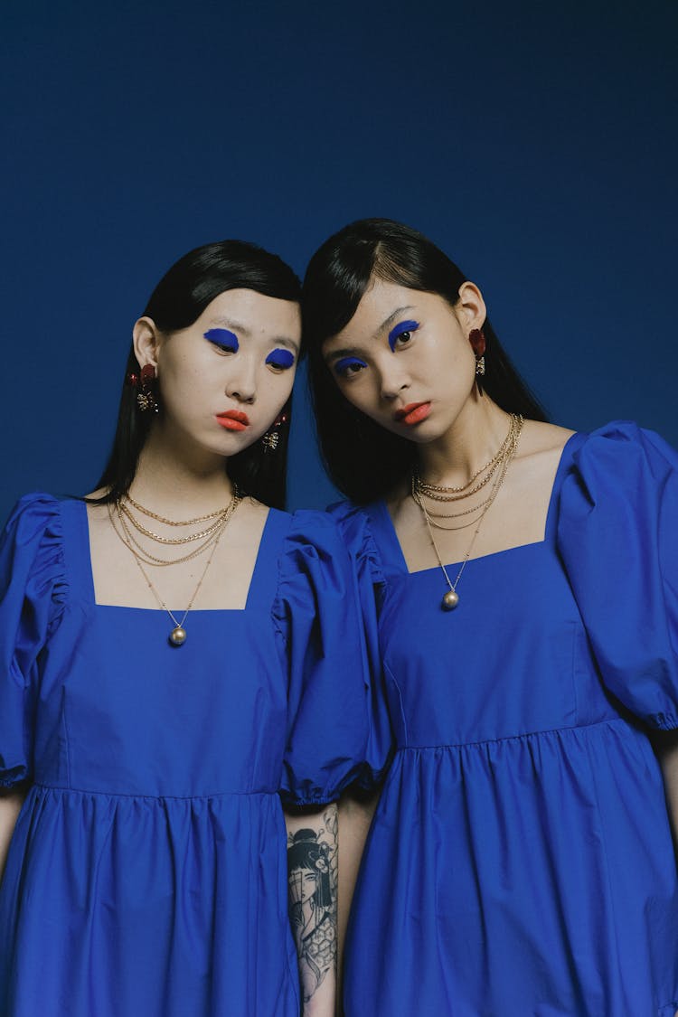 Women With Blue Eyeshadows And Matching Outfit