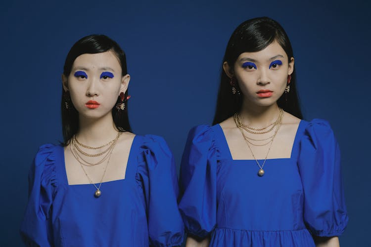 Women With Blue Eyeshadows And Matching Outfit