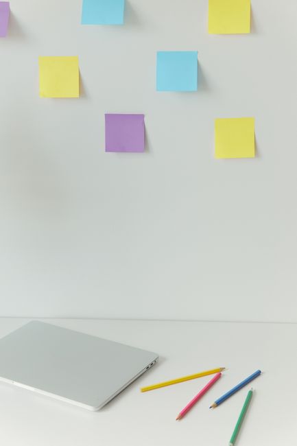 study desk with notebook pencils and colorful planning notes