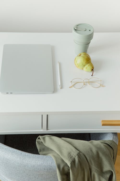 White Laptop Computer on White Table