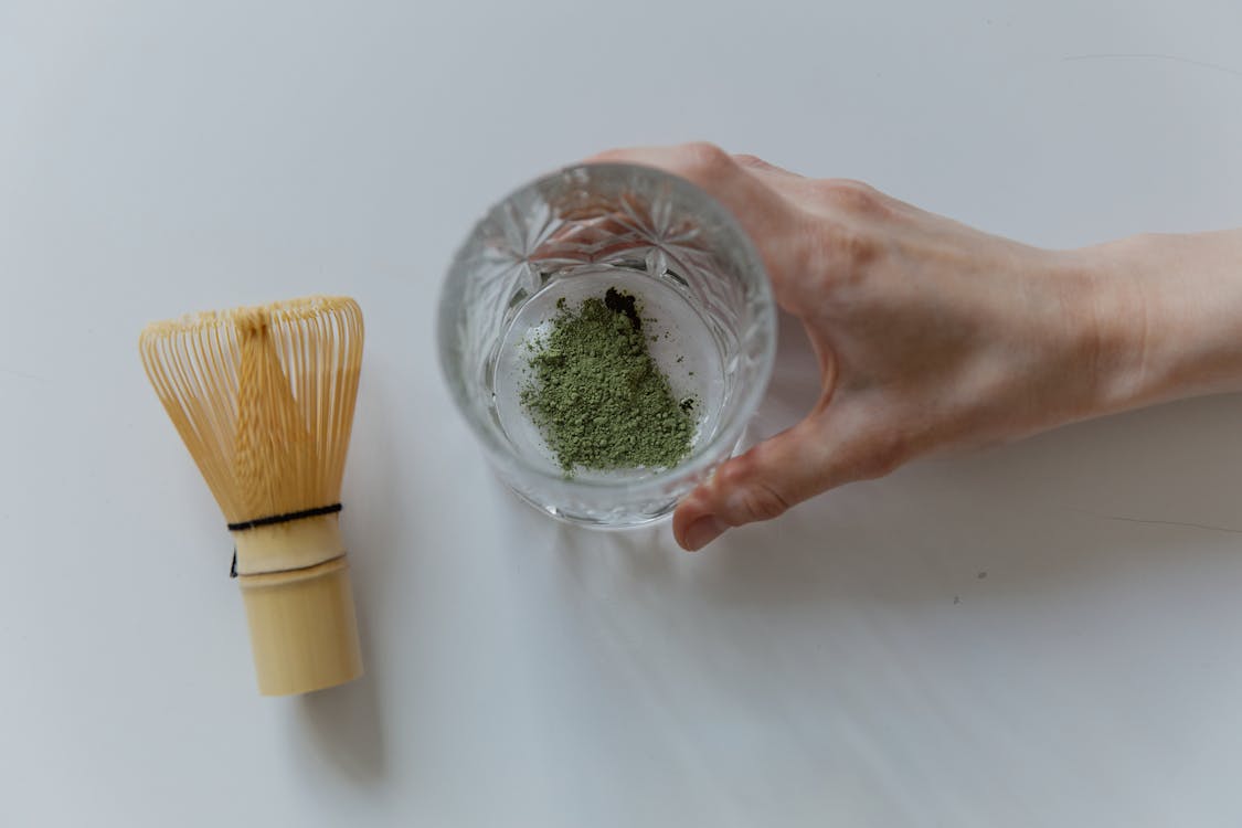 Free Top View Photo of Matcha Powder on Clear Glass Stock Photo