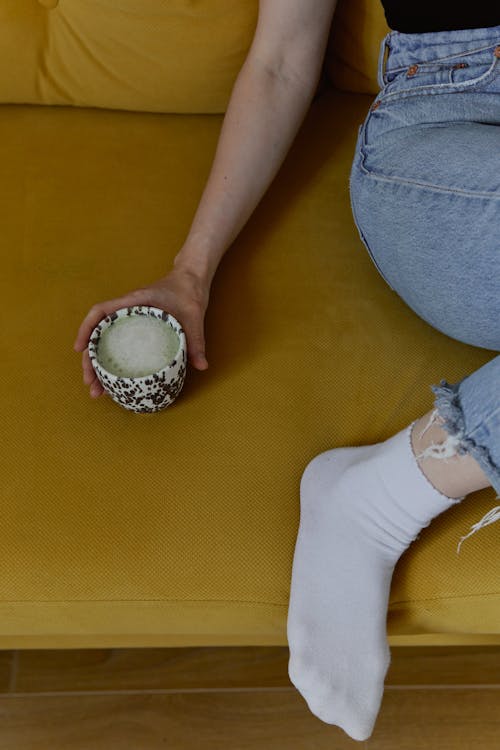 A Person Holding a Cup of Hot Drink