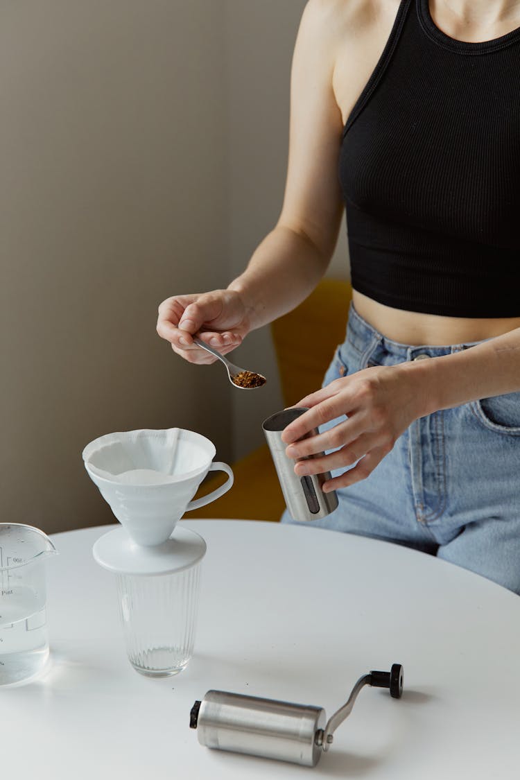 A Person Making Brewed Coffee