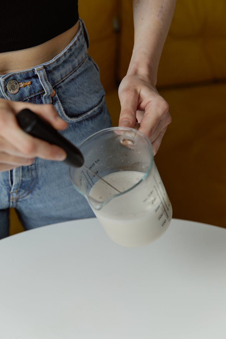 Woman Holding Jug Of Milk