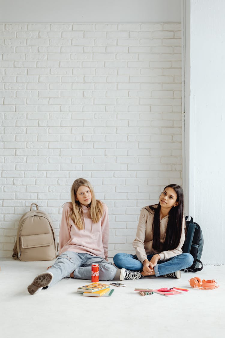 Young Women Sitting On The Floor