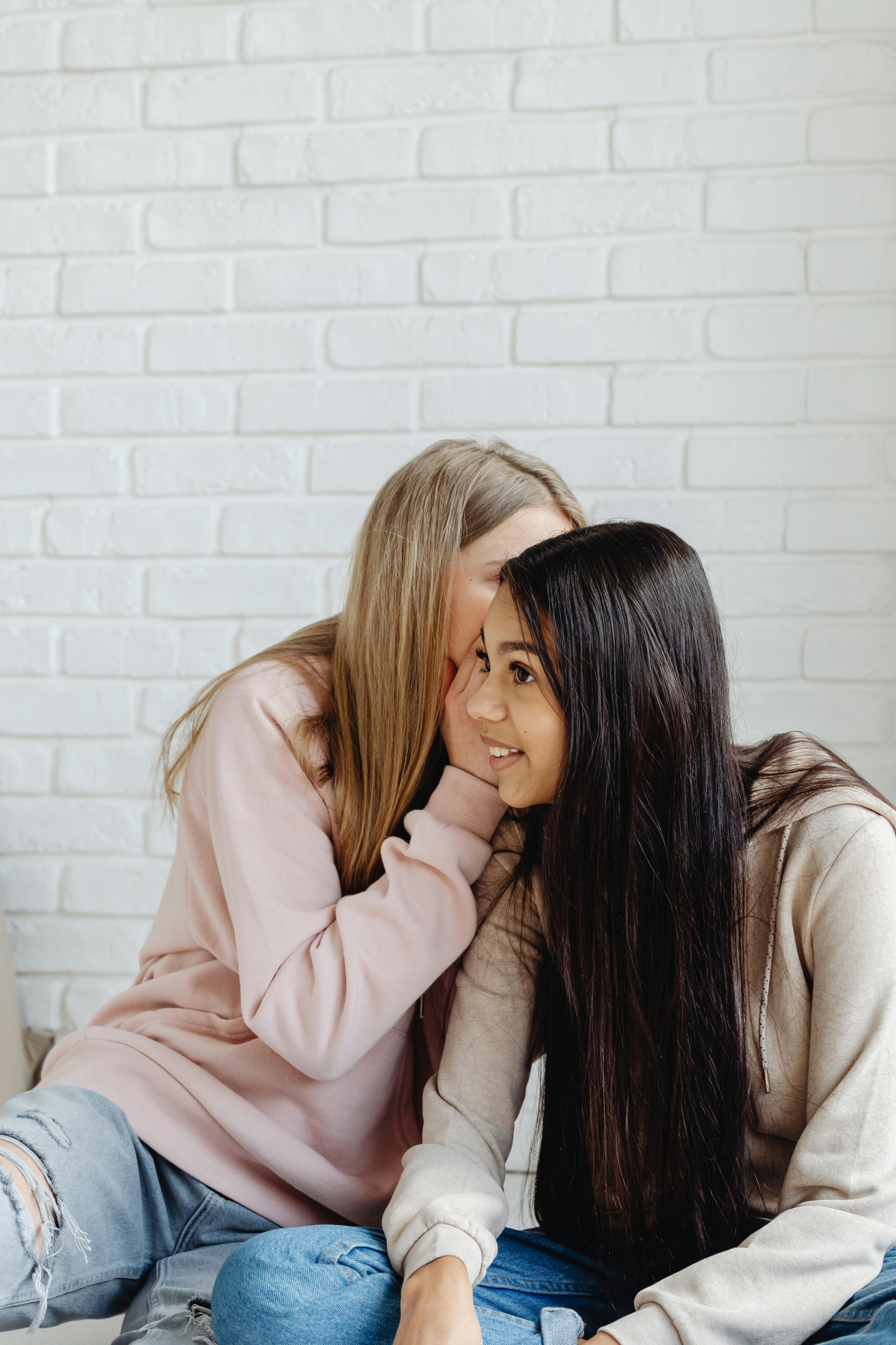 two female teenagers having a conversation