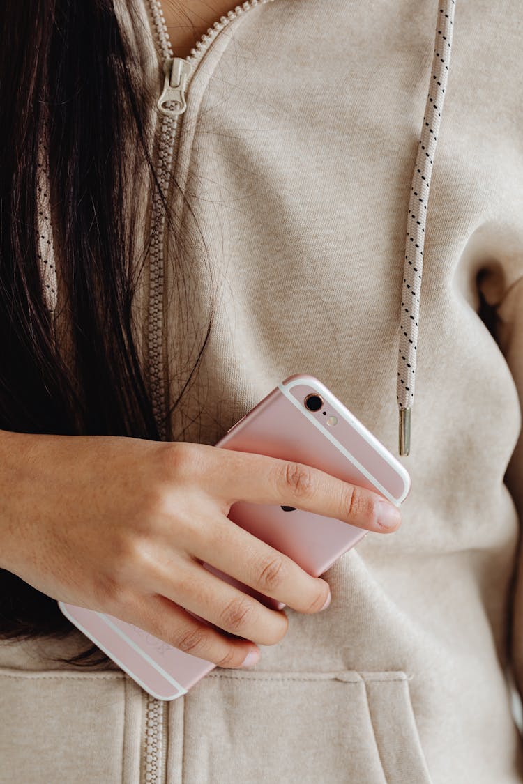 Girl In Beige Hoodie Holding Pink Mobile Phone