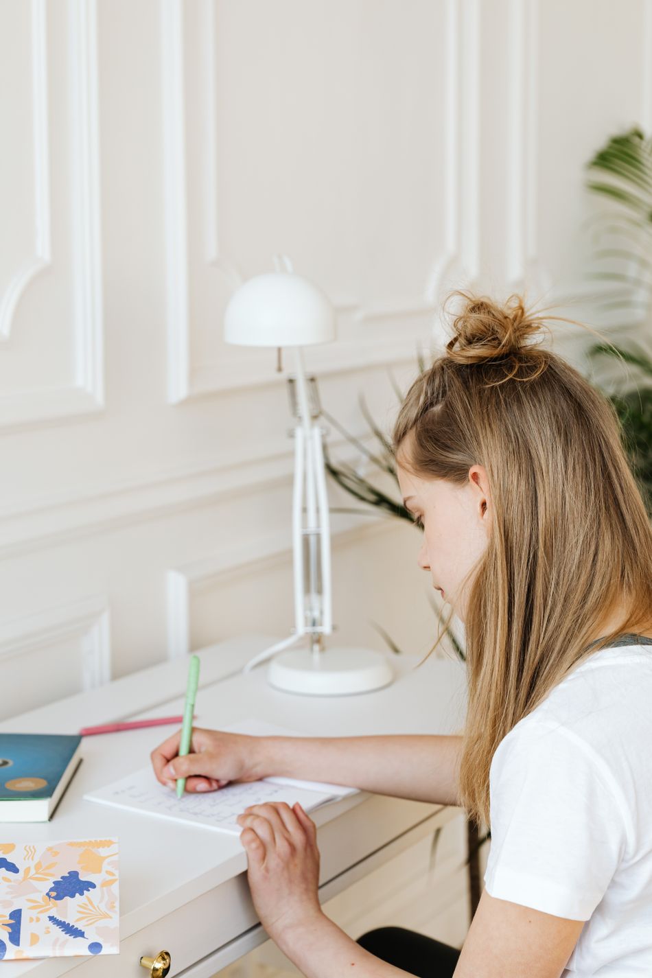 Teen student working on homework at a desk
