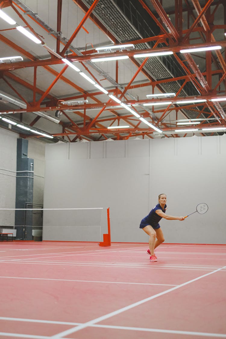 A Woman Playing Badminton 