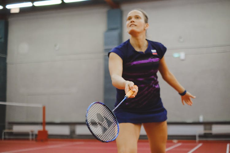 A Woman Playing Badminton