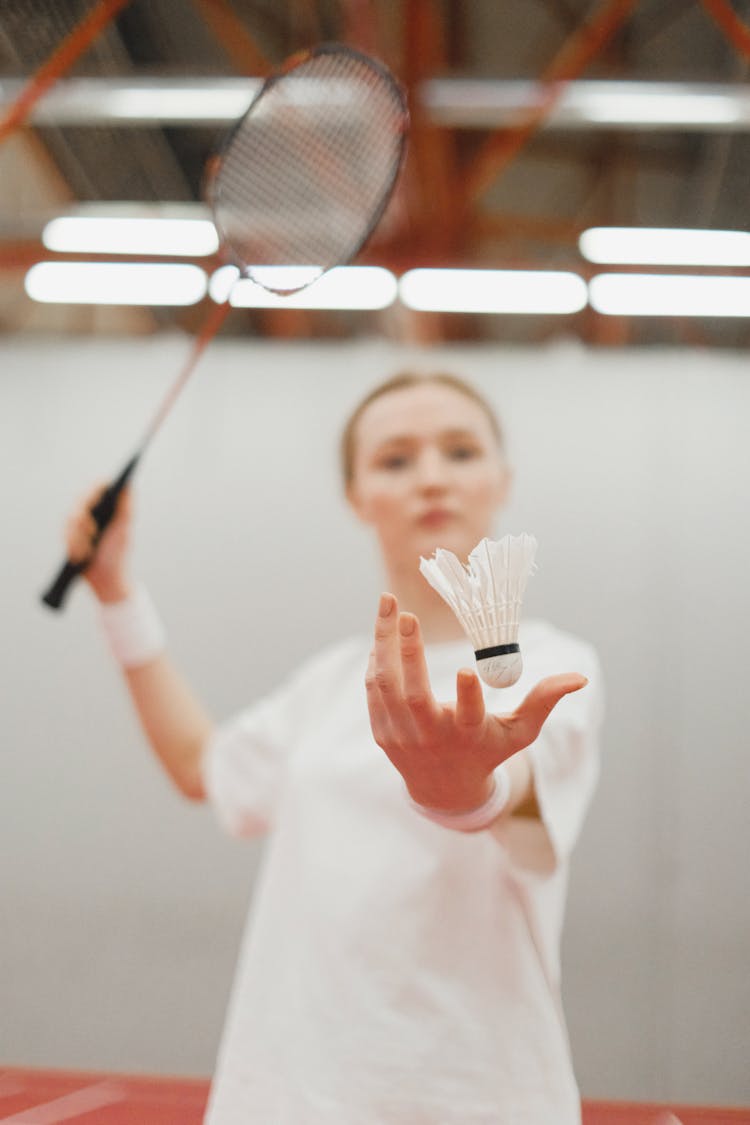 A Woman Playing Badminton 