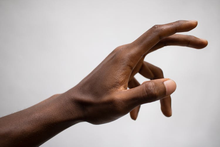 Crop Ethnic Person Pulling Hand Up