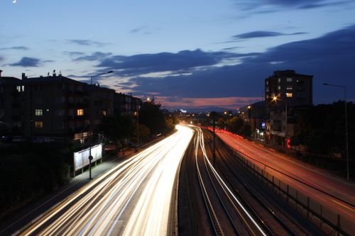 Free Long exposure photo capturing light trails on a bustling highway at twilight. Stock Photo